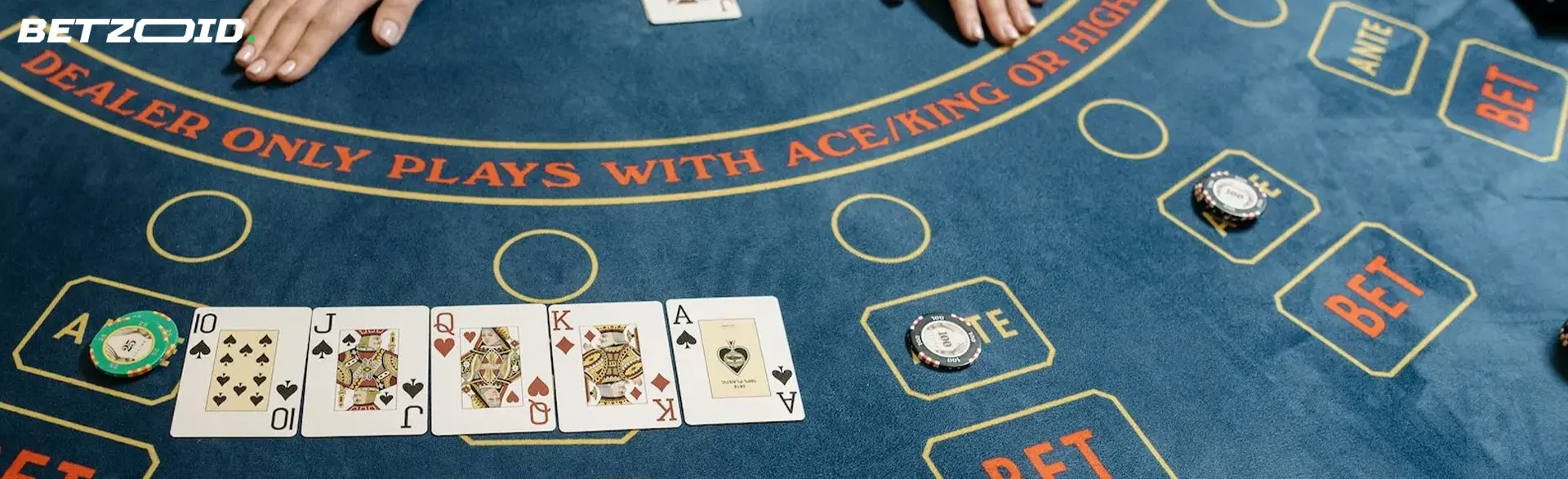 Casino table with cards and chips.