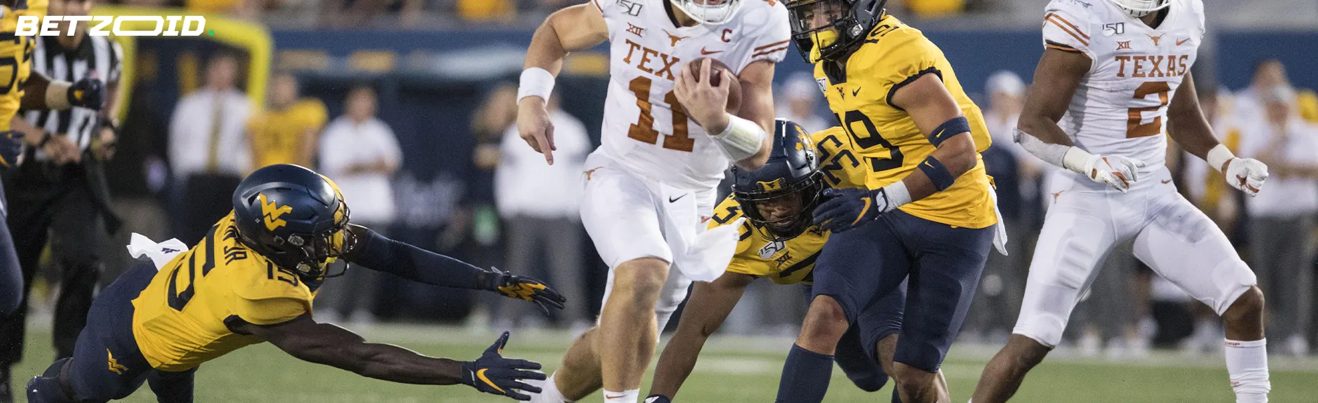 American football players fight for the ball.