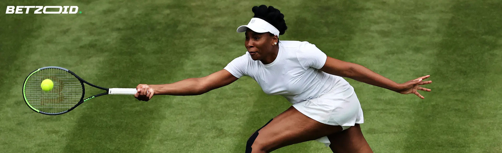 A tennis player is trying to hit the ball.